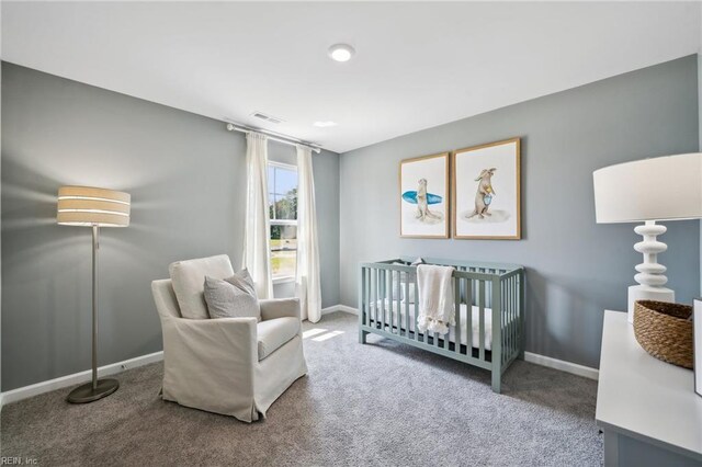 3019 Dalton Cir, Suffolk, VA 23435 - bedroom with carpet, baseboards, and a crib