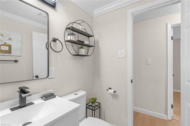 103 E Weaver Rd, Hampton, VA 23666 - bathroom featuring a sink, toilet, ornamental molding, wood finished floors, and baseboards