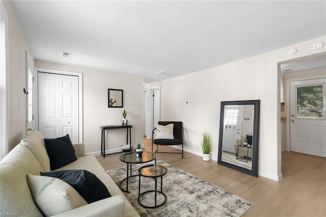 103 E Weaver Rd, Hampton, VA 23666 - living room featuring light wood-type flooring, plenty of natural light, and baseboards