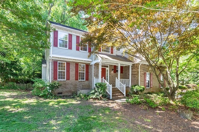 1209 Willow Creek Ct, Chesapeake, VA 23321 - view of front facade featuring crawl space, brick siding, a front lawn, and covered porch