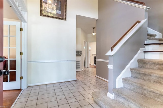 1209 Willow Creek Ct, Chesapeake, VA 23321 - tiled foyer entrance featuring stairway, baseboards, and a towering ceiling