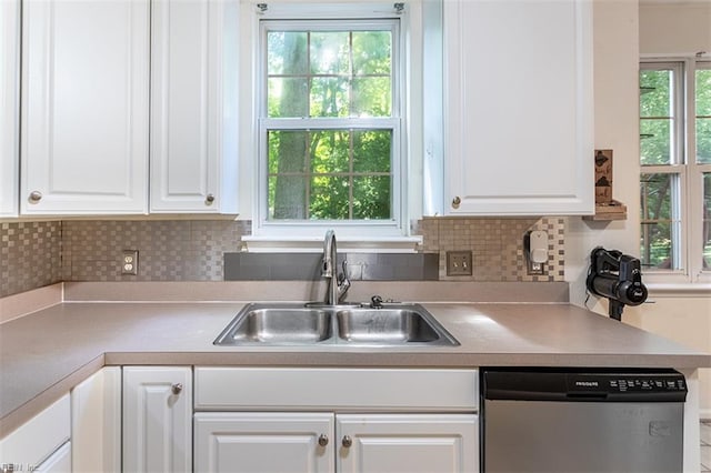 1209 Willow Creek Ct, Chesapeake, VA 23321 - kitchen featuring dishwasher, a sink, white cabinetry, backsplash, and light countertops
