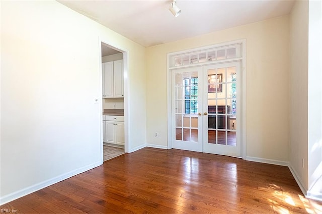 1209 Willow Creek Ct, Chesapeake, VA 23321 - entryway featuring french doors, wood finished floors, and baseboards