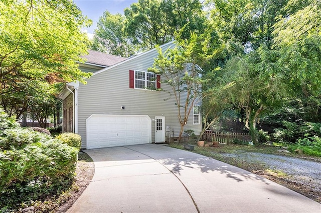 1209 Willow Creek Ct, Chesapeake, VA 23321 - view of side of home with driveway and a garage