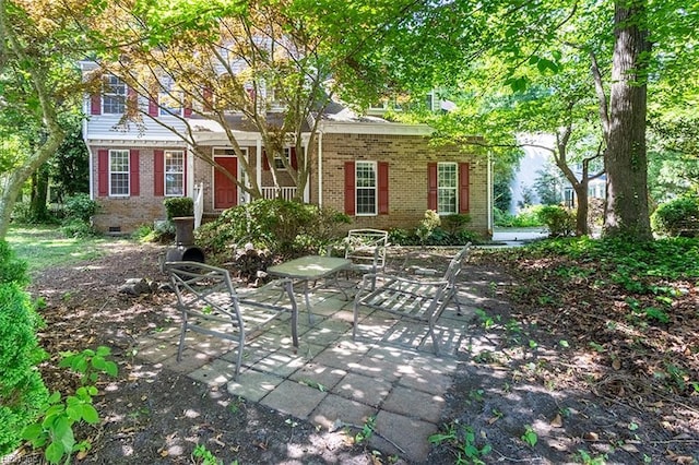 1209 Willow Creek Ct, Chesapeake, VA 23321 - view of front of property with brick siding, crawl space, and a patio