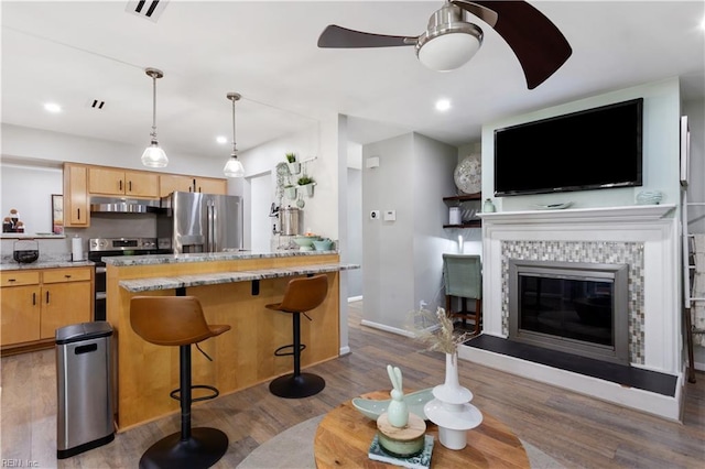 164 Nottingham Trl, Newport News, VA 23602 - kitchen with appliances with stainless steel finishes, under cabinet range hood, ceiling fan, light brown cabinets, and wood finished floors