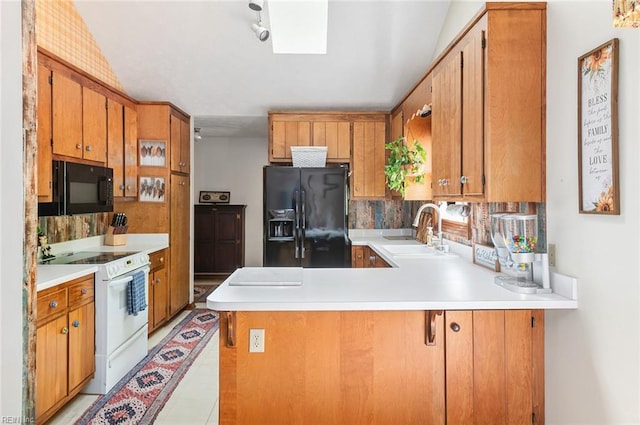 3408 Waterview Rd, Toano, VA 23168 - kitchen with black appliances, a sink, a peninsula, light countertops, and brown cabinets