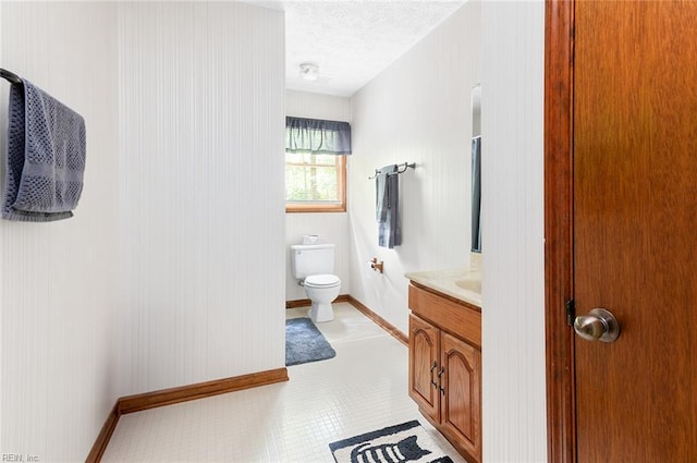 3408 Waterview Rd, Toano, VA 23168 - bathroom featuring vanity, a textured ceiling, toilet, and baseboards