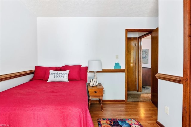 3408 Waterview Rd, Toano, VA 23168 - bedroom with wood finished floors, a textured ceiling, and baseboards