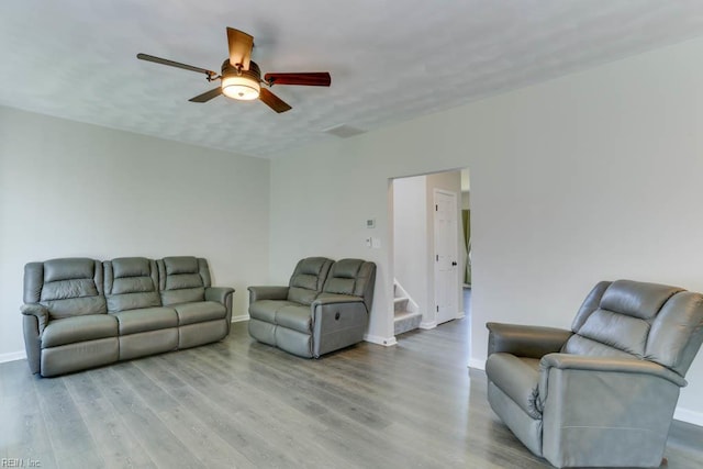 2825 Ridgeboard Pl, Chesapeake, VA 23323 - living area featuring wood finished floors, ceiling fan, baseboards, and stairway