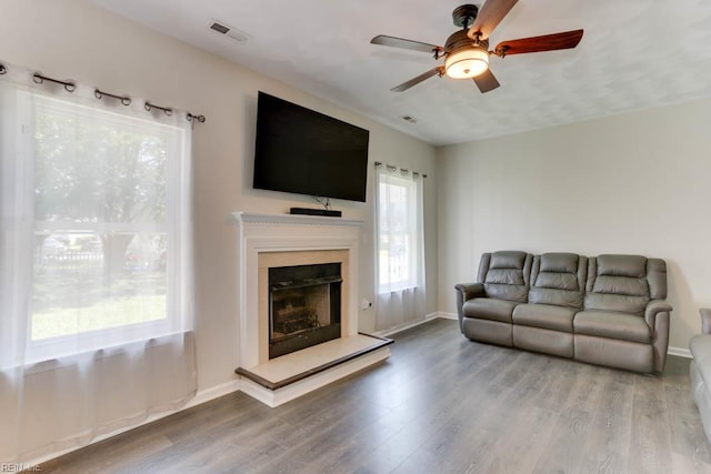 2825 Ridgeboard Pl, Chesapeake, VA 23323 - living area with healthy amount of natural light, a ceiling fan, wood finished floors, and baseboards