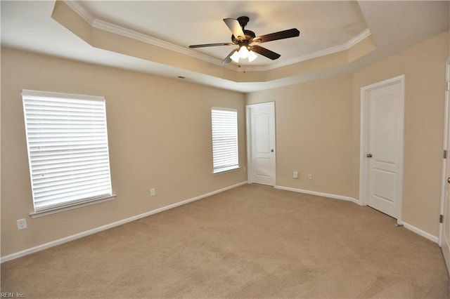233 Verde St, Virginia Beach, VA 23462 - unfurnished room with ornamental molding, a tray ceiling, ceiling fan, light carpet, and baseboards