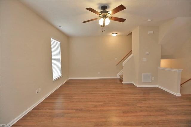 233 Verde St, Virginia Beach, VA 23462 - unfurnished room featuring baseboards, ceiling fan, wood finished floors, and stairs