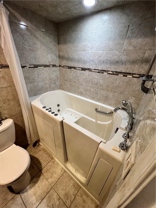 5113 Stratford Chase Dr, Virginia Beach, VA 23464 - full bath with tile walls, a jetted tub, toilet, and tile patterned floors