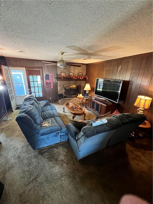 5113 Stratford Chase Dr, Virginia Beach, VA 23464 - carpeted living area featuring wooden walls, a textured ceiling, and a fireplace