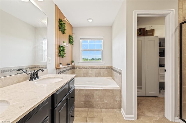 1925 Dale Greene Pl, Virginia Beach, VA 23456 - bathroom with a bath, double vanity, tile patterned flooring, a closet, and an enclosed shower