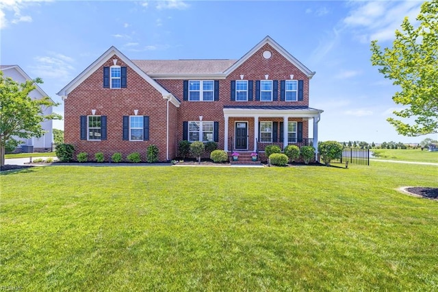 1925 Dale Greene Pl, Virginia Beach, VA 23456 - view of front of property featuring brick siding, a front yard, and covered porch