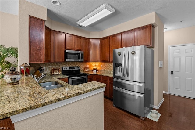 331 Fountain Way Unit 66, Hampton, VA 23666 - kitchen with stainless steel appliances, a sink, light stone countertops, a peninsula, and decorative backsplash