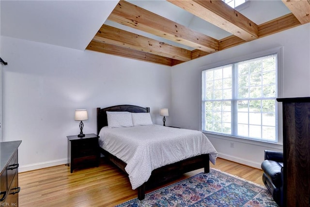 117 Shinnecock, Williamsburg, VA 23188 - bedroom featuring baseboards, beamed ceiling, and light wood-style floors