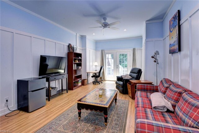 117 Shinnecock, Williamsburg, VA 23188 - living room featuring a decorative wall, french doors, light wood-type flooring, ornamental molding, and a ceiling fan