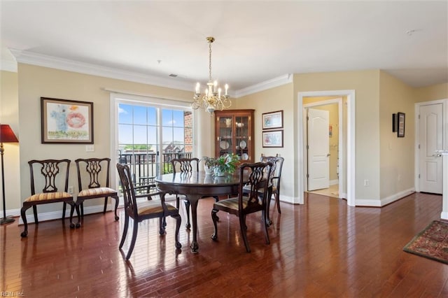 5414 Foundation St, Williamsburg, VA 23188 - dining room featuring baseboards, a chandelier, dark wood-type flooring, and ornamental molding
