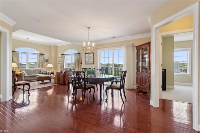 5414 Foundation St, Williamsburg, VA 23188 - dining room featuring a chandelier, dark wood-type flooring, ornamental molding, and baseboards