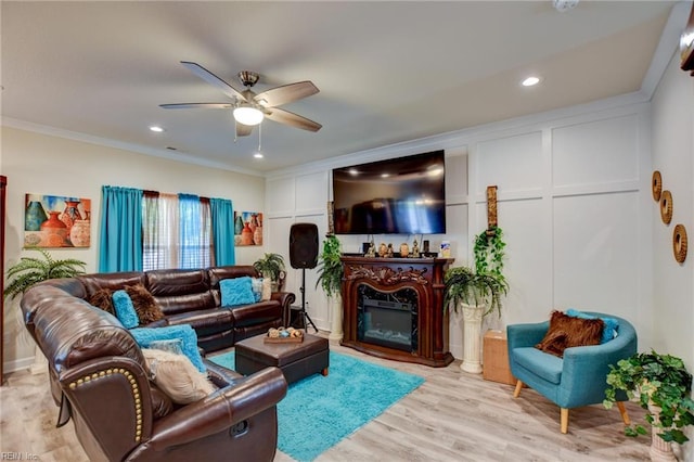 101 Utah St, Portsmouth, VA 23701 - living room with ceiling fan, crown molding, light wood-type flooring, a glass covered fireplace, and recessed lighting
