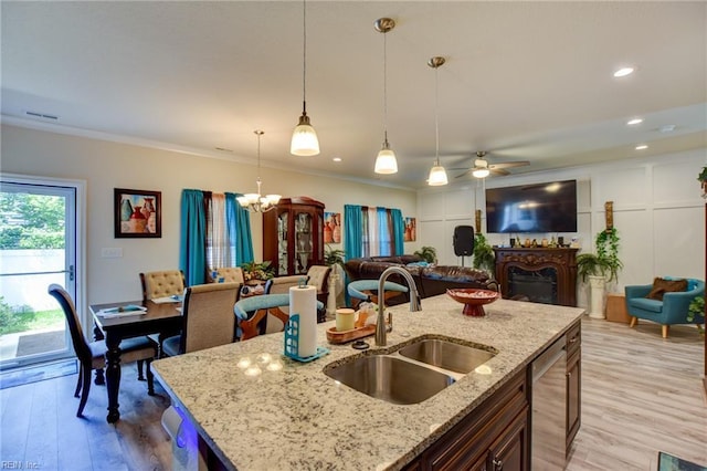 101 Utah St, Portsmouth, VA 23701 - kitchen featuring a sink, open floor plan, a ceiling fan, pendant lighting, and light wood-style floors