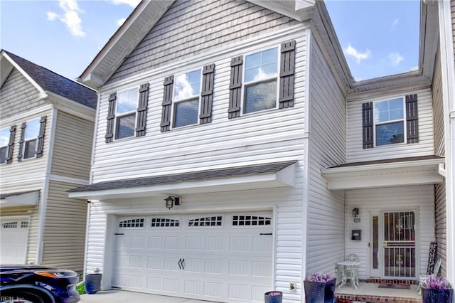 101 Utah St, Portsmouth, VA 23701 - view of front facade with an attached garage and concrete driveway