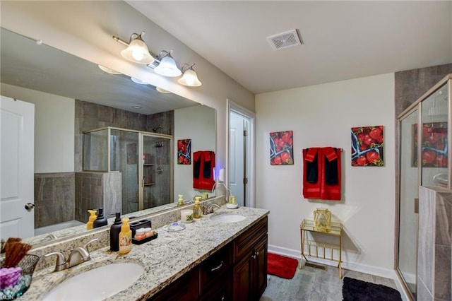 101 Utah St, Portsmouth, VA 23701 - bathroom featuring a shower stall, double vanity, baseboards, and a tub