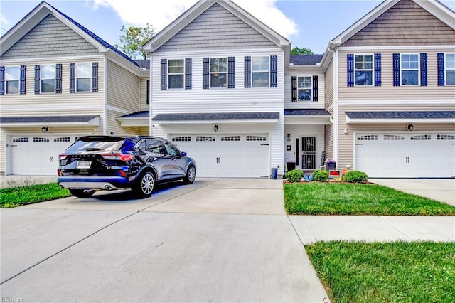 101 Utah St, Portsmouth, VA 23701 - view of front facade with a garage and driveway