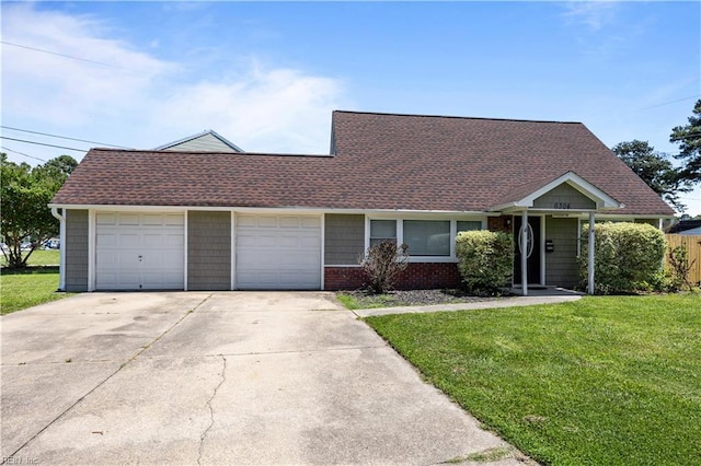 6304 Ball Ave, Norfolk, VA 23518 - view of front of house with a front lawn, concrete driveway, a garage, and a shingled roof