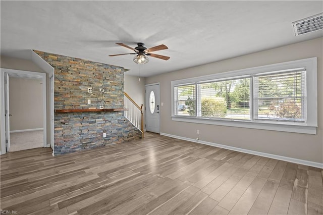 6304 Ball Ave, Norfolk, VA 23518 - unfurnished living room with baseboards, a ceiling fan, wood finished floors, and stairs