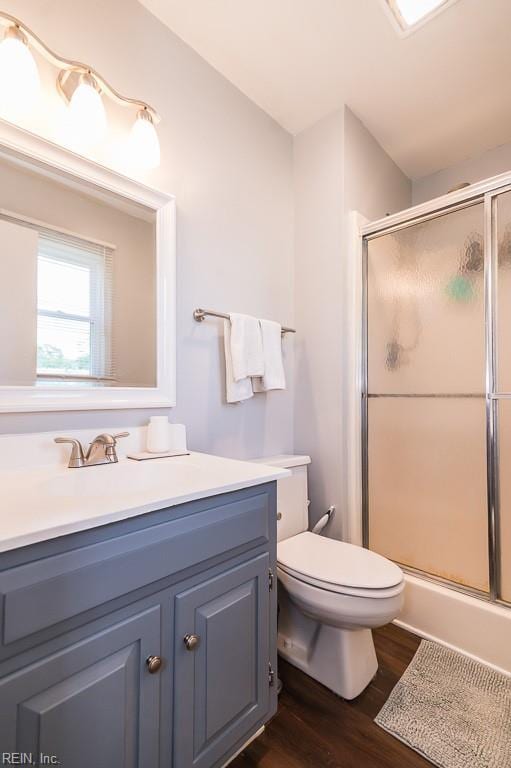 1 Lake Walk Xing, Hampton, VA 23666 - bathroom featuring a shower with shower door, vanity, wood finished floors, and toilet