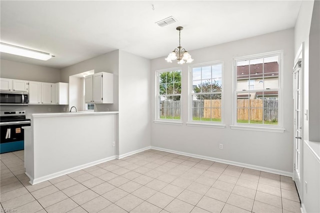 405 Millwright Way, Chesapeake, VA 23323 - kitchen featuring appliances with stainless steel finishes, a chandelier, light countertops, white cabinetry, and hanging light fixtures