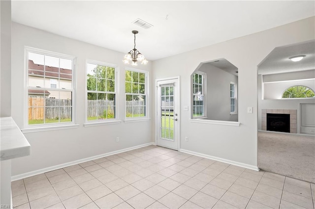 405 Millwright Way, Chesapeake, VA 23323 - unfurnished dining area featuring a chandelier, baseboards, a tile fireplace, and light tile patterned flooring