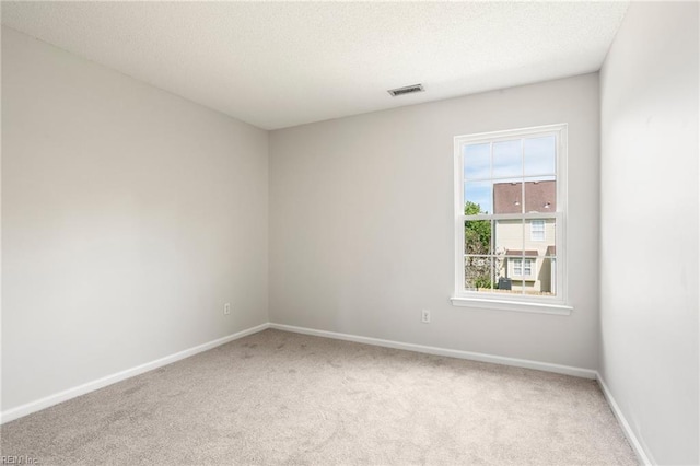 405 Millwright Way, Chesapeake, VA 23323 - empty room featuring light carpet, baseboards, and a textured ceiling
