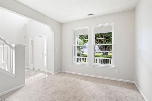 405 Millwright Way, Chesapeake, VA 23323 - unfurnished room featuring light colored carpet, baseboards, stairway, and arched walkways
