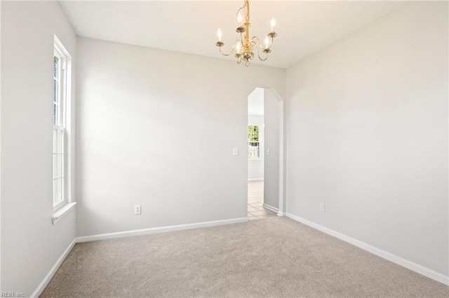 405 Millwright Way, Chesapeake, VA 23323 - unfurnished room with arched walkways, a chandelier, carpet, and baseboards