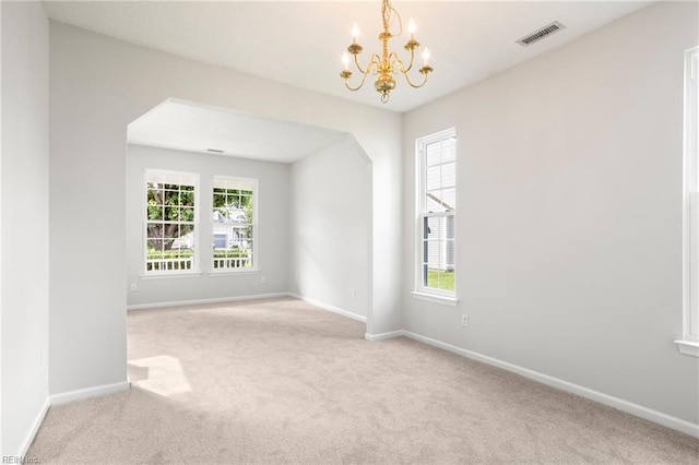405 Millwright Way, Chesapeake, VA 23323 - carpeted empty room featuring a chandelier, baseboards, and arched walkways