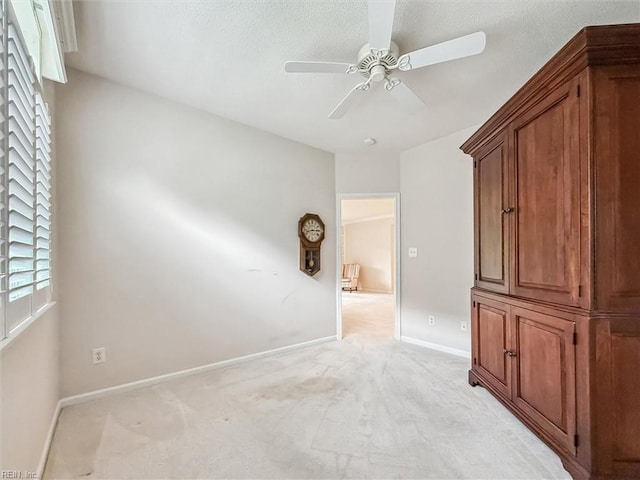 145 Shoal Crk, Williamsburg, VA 23188 - spare room featuring a ceiling fan, baseboards, and light carpet