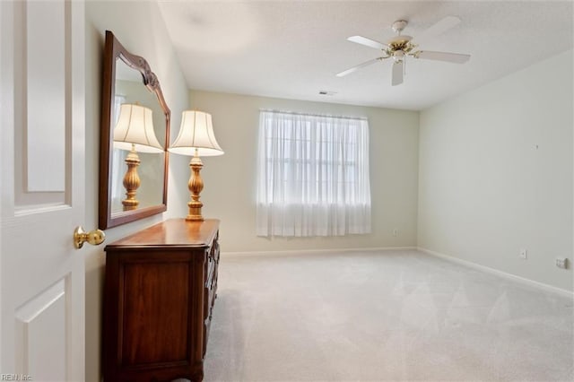 145 Shoal Crk, Williamsburg, VA 23188 - unfurnished bedroom with light colored carpet, baseboards, and a ceiling fan