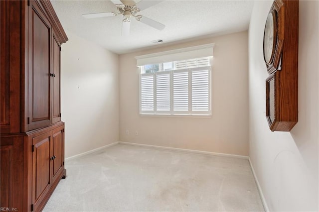 145 Shoal Crk, Williamsburg, VA 23188 - spare room with light carpet, baseboards, and a ceiling fan