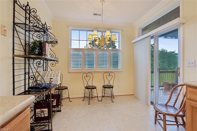 145 Shoal Crk, Williamsburg, VA 23188 - dining room featuring ornamental molding, a chandelier, baseboards, and light floors