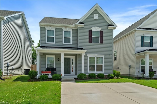 230 Independence St, Portsmouth, VA 23701 - view of front facade with a porch, a standing seam roof, a front yard, cooling unit, and metal roof