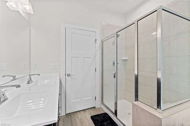 230 Independence St, Portsmouth, VA 23701 - bathroom with a stall shower, wood finished floors, and double vanity