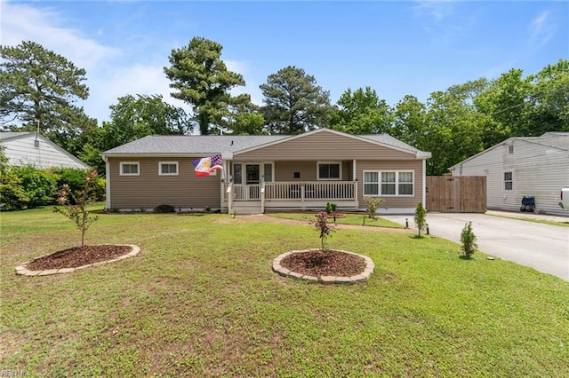 8332 Halprin Dr, Norfolk, VA 23518 - back of house with driveway, covered porch, and a yard