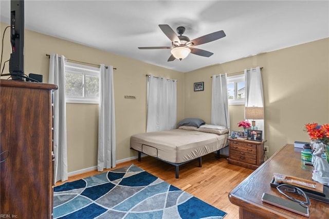 8332 Halprin Dr, Norfolk, VA 23518 - bedroom featuring multiple windows, wood finished floors, and a ceiling fan