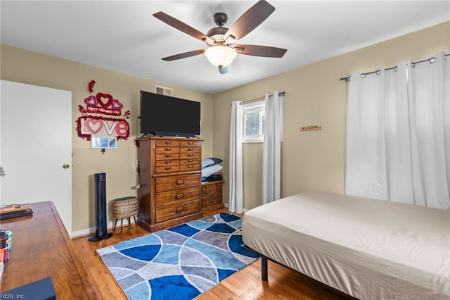 8332 Halprin Dr, Norfolk, VA 23518 - bedroom with wood finished floors, baseboards, and a ceiling fan