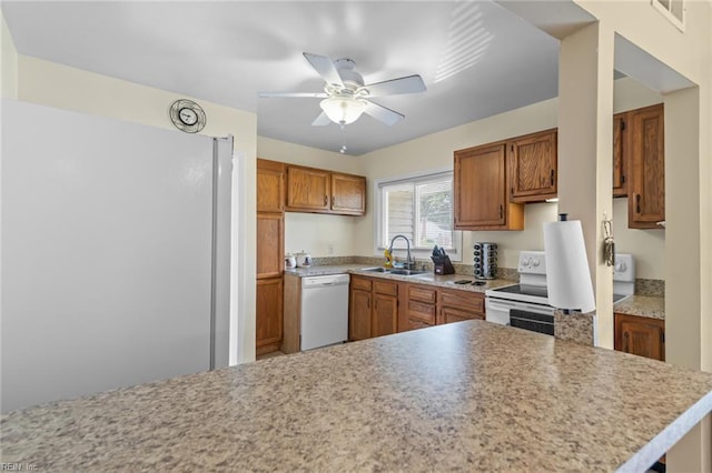 8332 Halprin Dr, Norfolk, VA 23518 - kitchen with white appliances, a sink, ceiling fan, light countertops, and brown cabinets